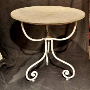 A French 19th wrought iron and travertine top Gueridon